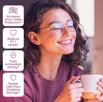 Smiling woman enjoying a cup of coffee while VINIA benefits are listed beside her: increases nitric oxide production, reduces ET-1 levels, fuels antioxidant activity, and shields cells from oxidative damage.